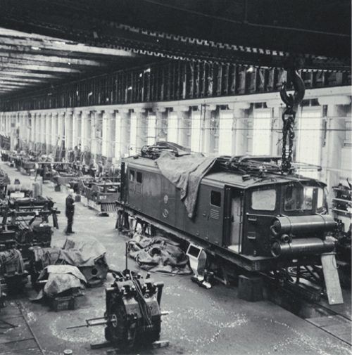 Christchurch to Lyttelton suburban Ec electric locomotive undergoing maintenance in the Addington Workshops [ca. 1960] CCL PhotoCD 11, IMG0054